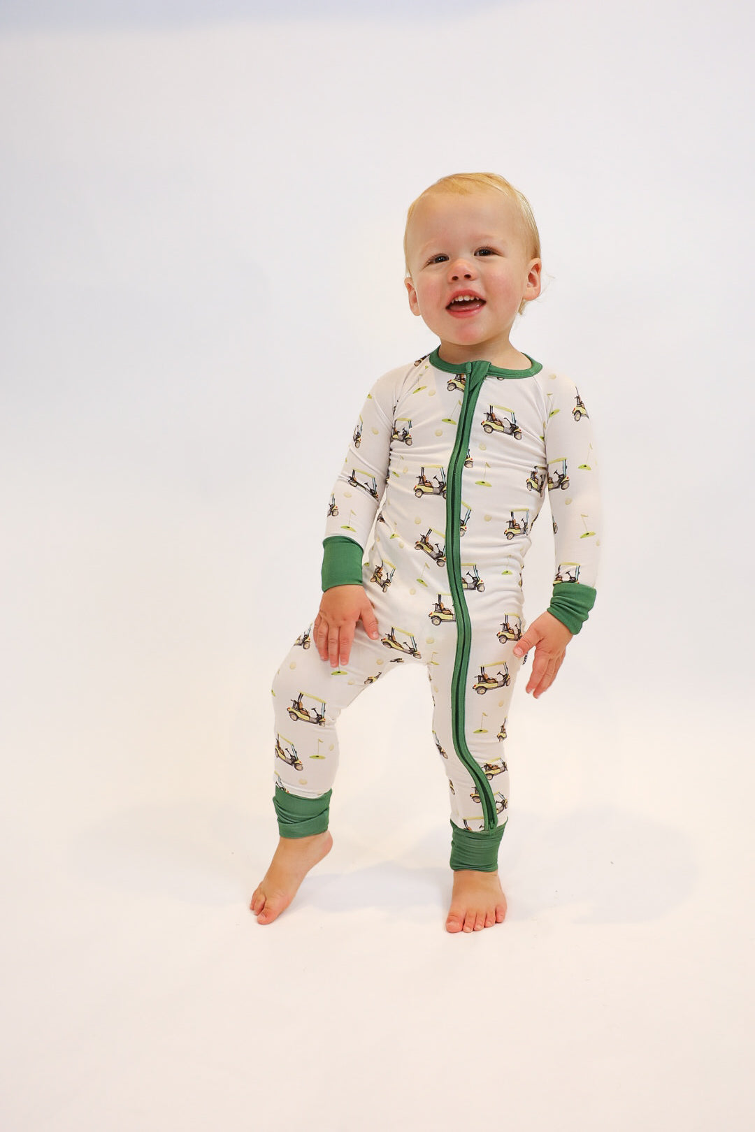 Double zipper baby romper with convertible hand & foot cuffs made from bamboo with green golf sports print for boys or girls.