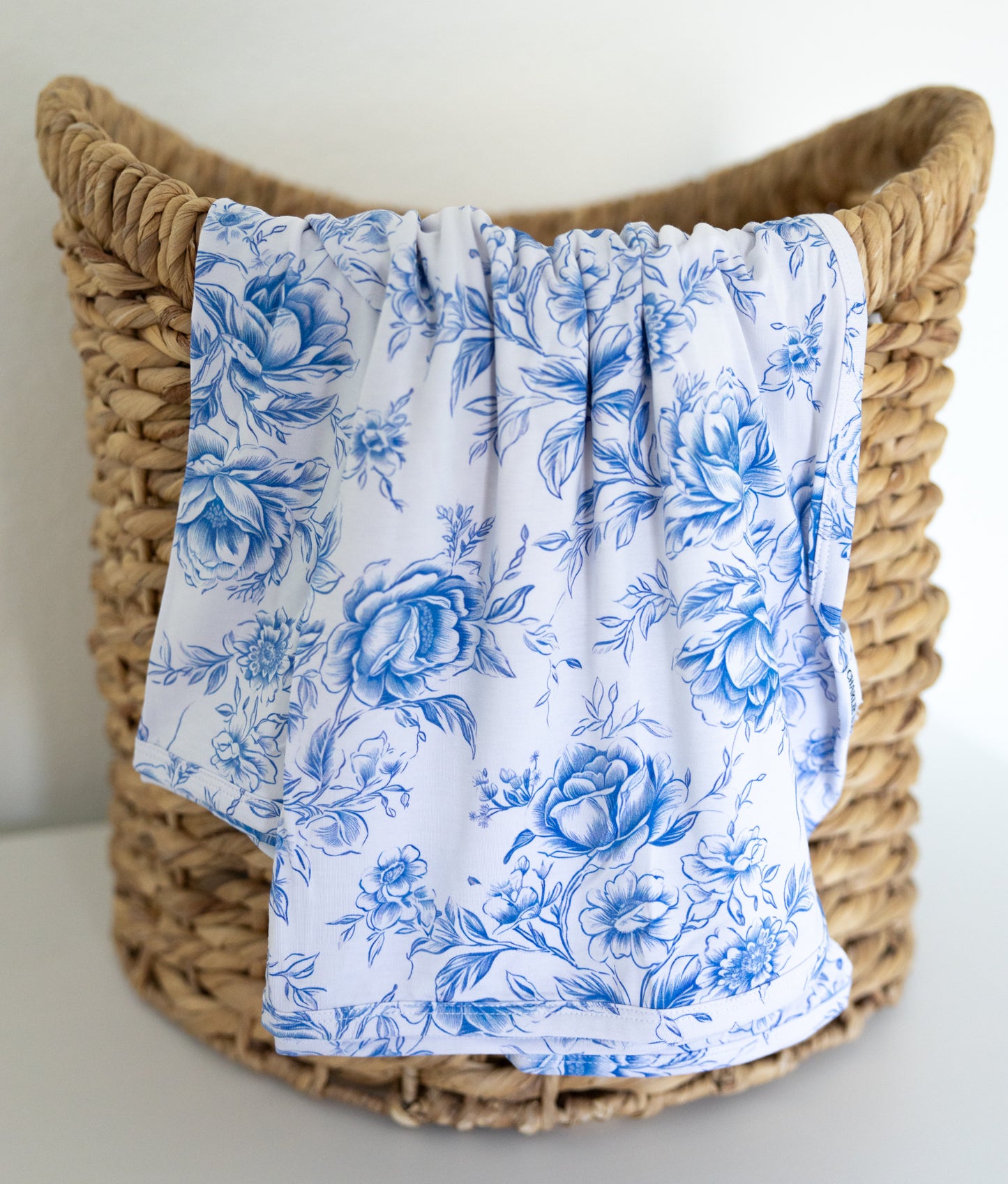 Blue floral toile bamboo swaddle for baby girl.