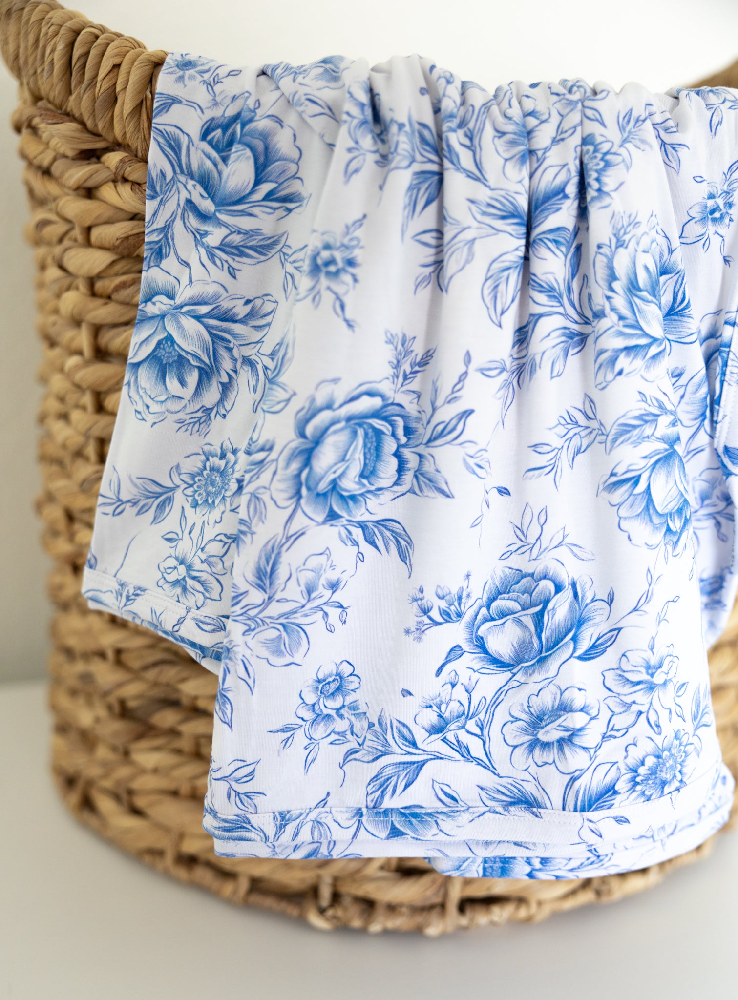 Blue floral toile bamboo swaddle for baby girl.