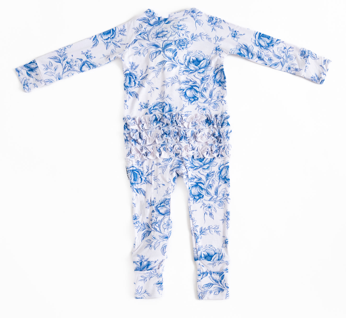 Bamboo zippy with ruffles with blue floral toile print for baby girl with double zippers and hand and foot cuffs.