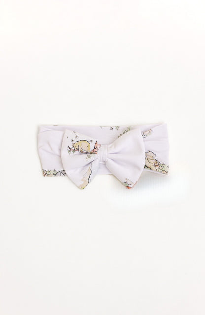 Bamboo baby bow with a Winnie the Pooh design.