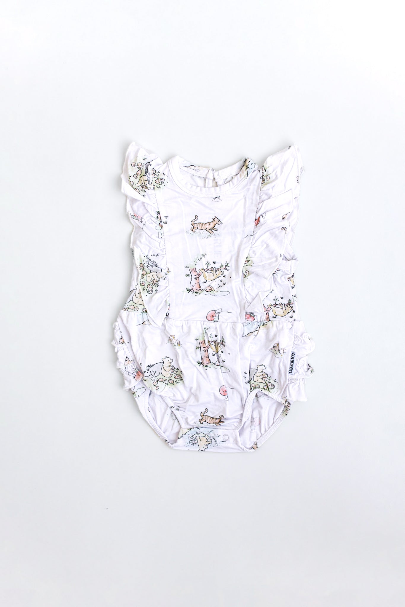 Winnie the Pooh bamboo baby bodysuit with Eeyore, Piglet and Pooh Bear in a ruffle bubble style.