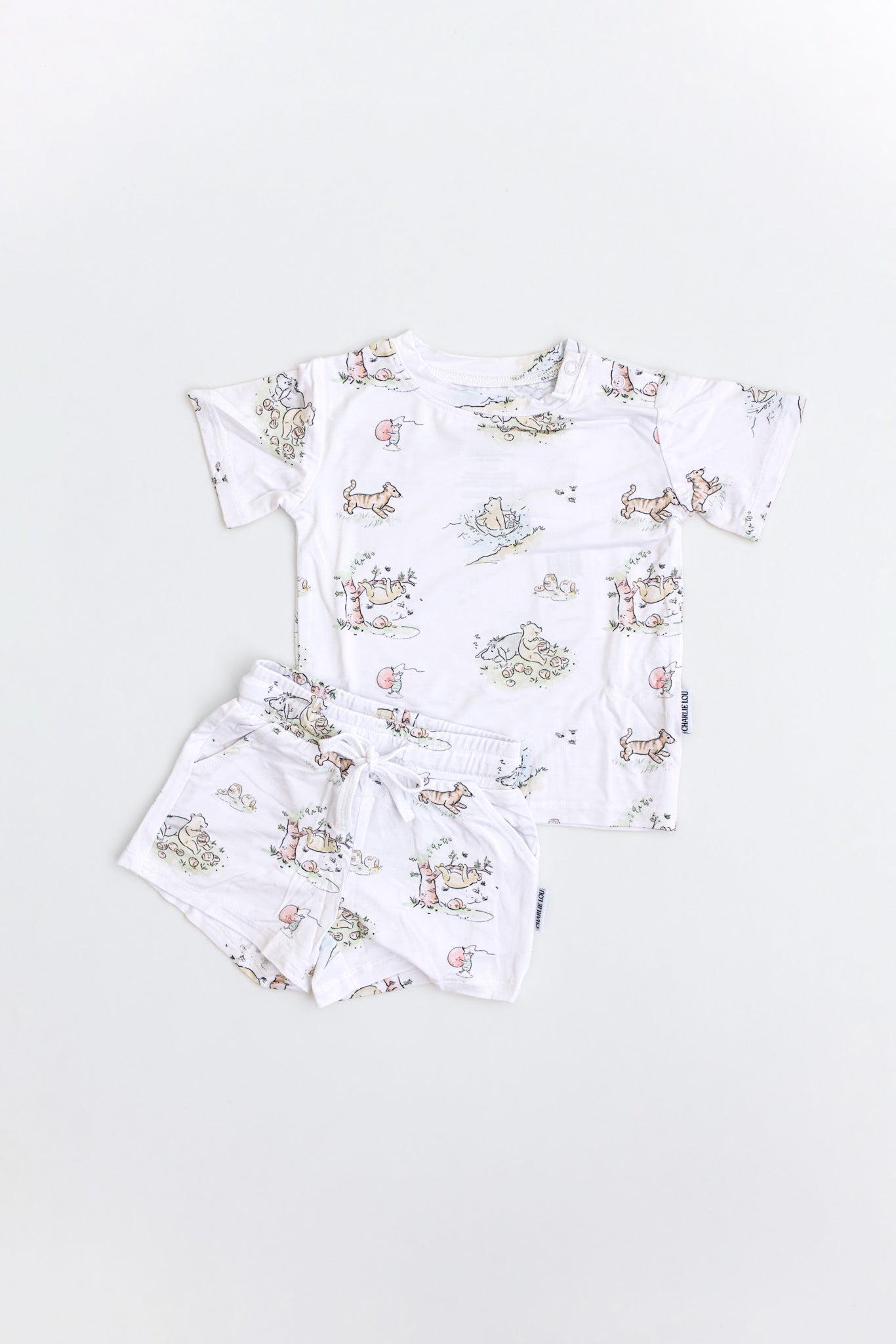 Winnie the Pooh bamboo short set with pockets and drawstring and shoulder snaps for baby and toddler boys and girls.