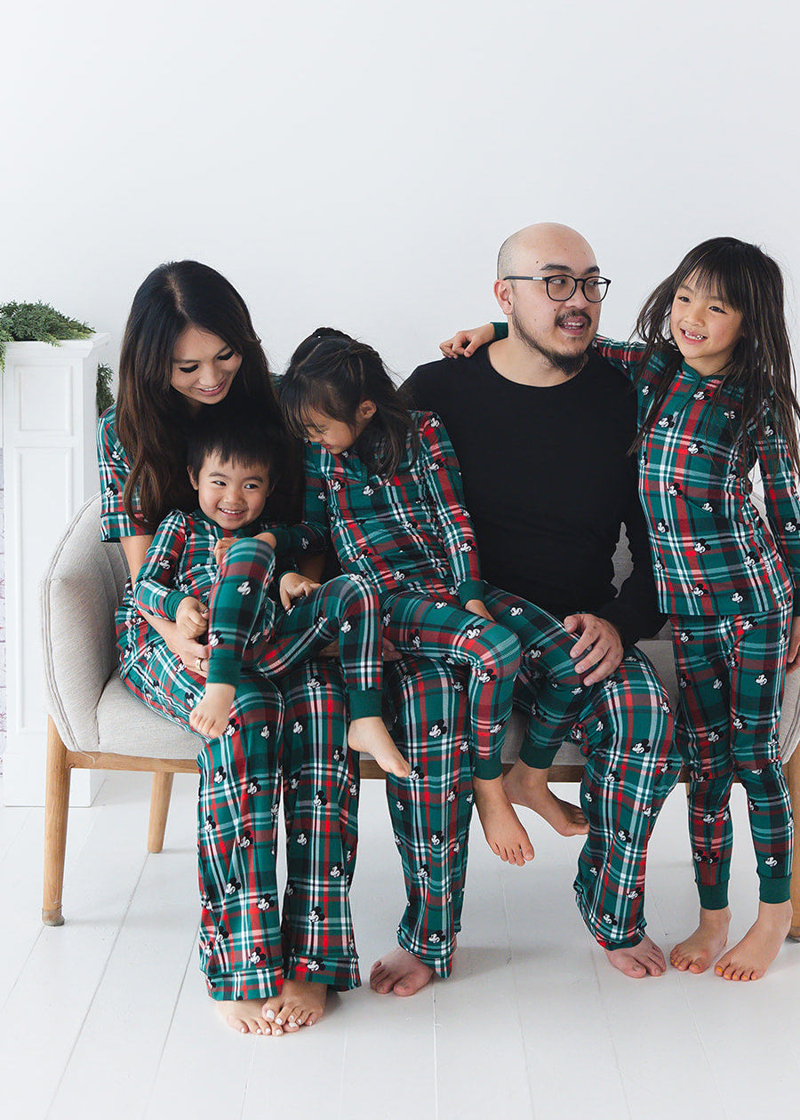 Family matching bamboo Christmas pajamas with Disney Mickey on green and red tartan print.
