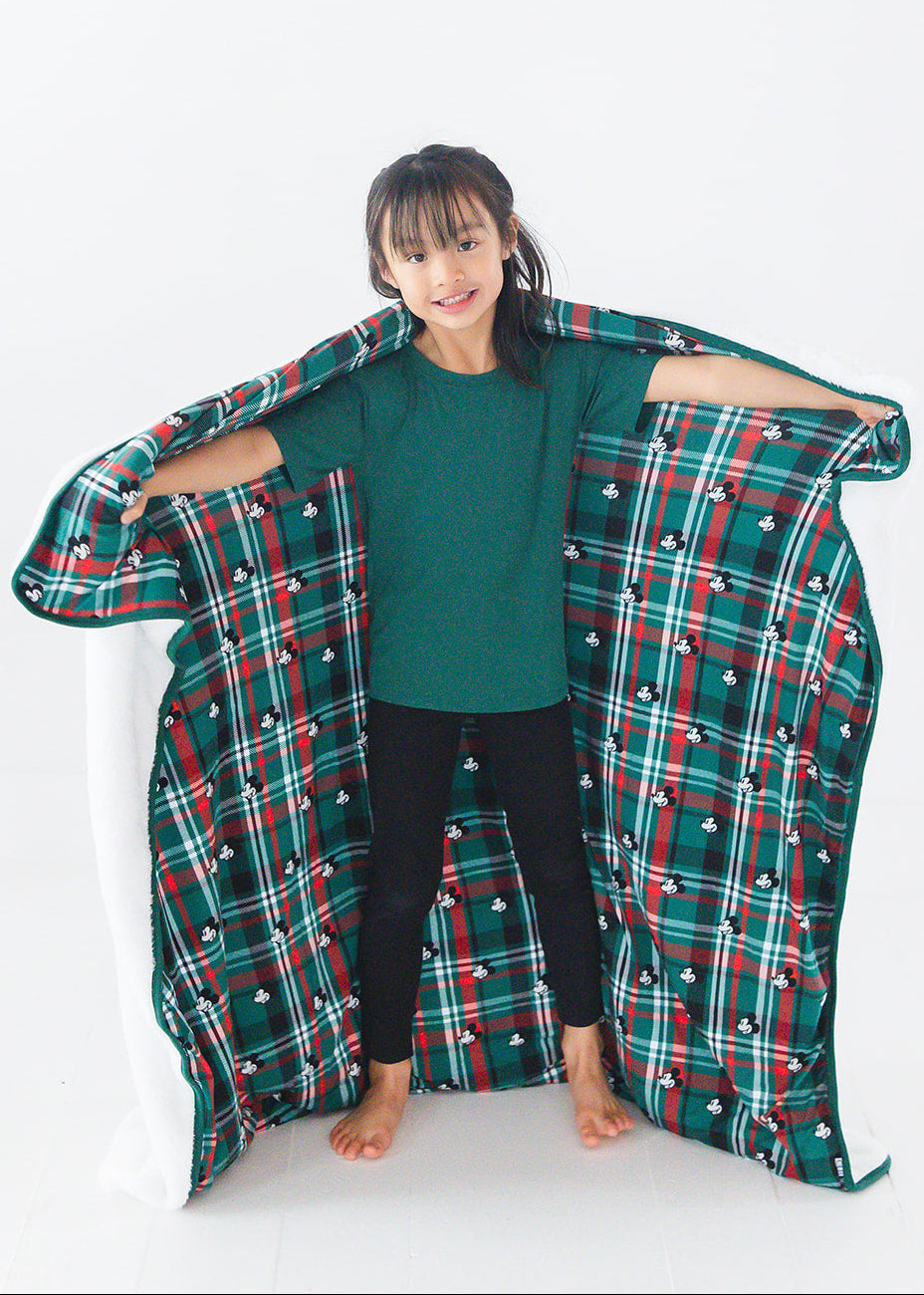 Green and red tartan bamboo plush blanket in Christmas Disney Mickey print.