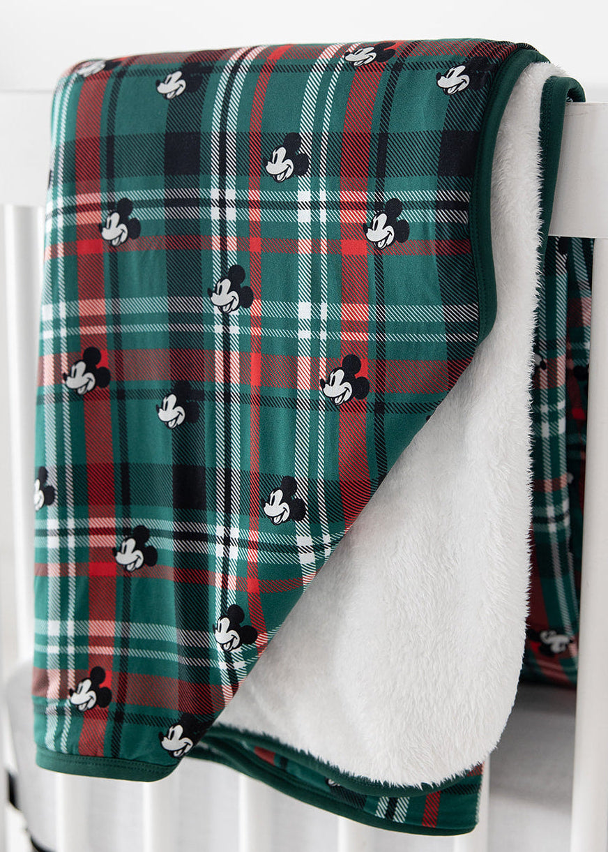 Green and red tartan bamboo plush blanket in Christmas Disney Mickey print.