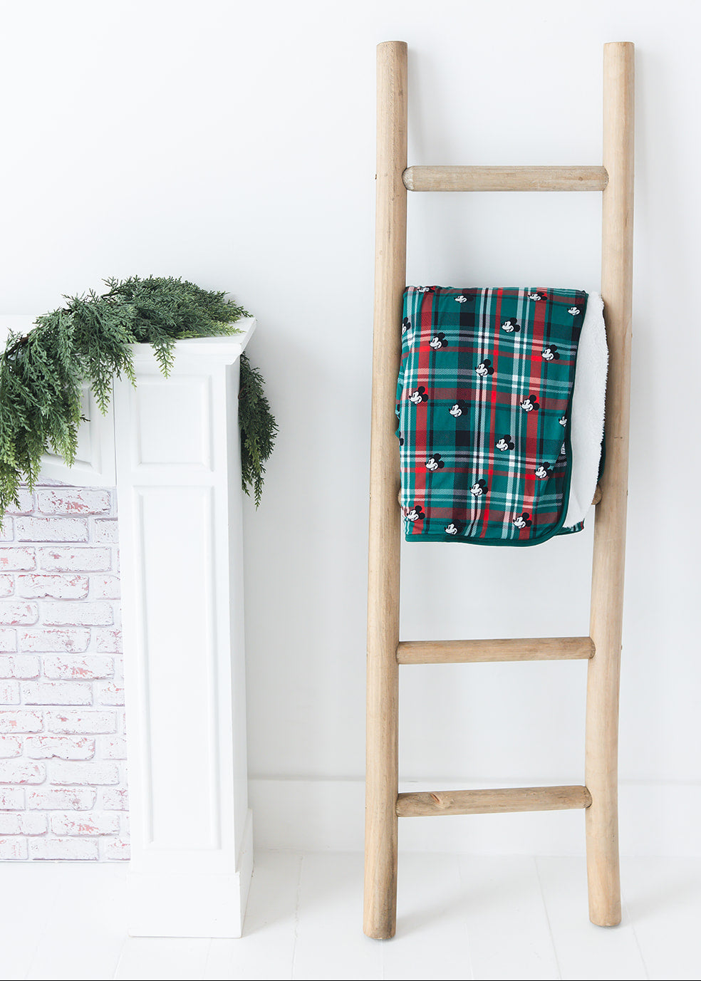 Green and red tartan bamboo plush blanket in Christmas Disney Mickey print.