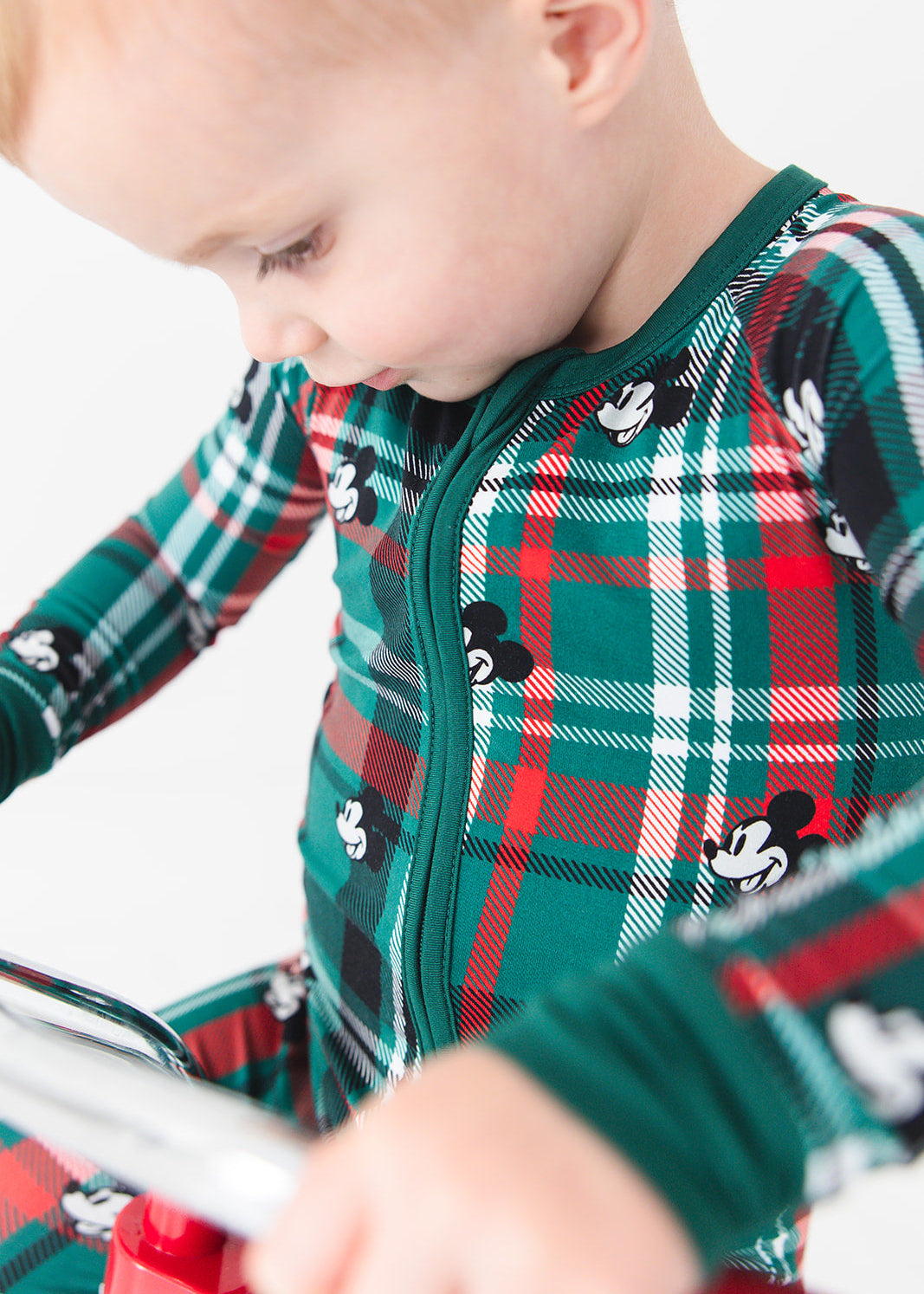 Convertible romper in zippy style with green and red tartan mickey disney print for Christmas family matching pajamas.