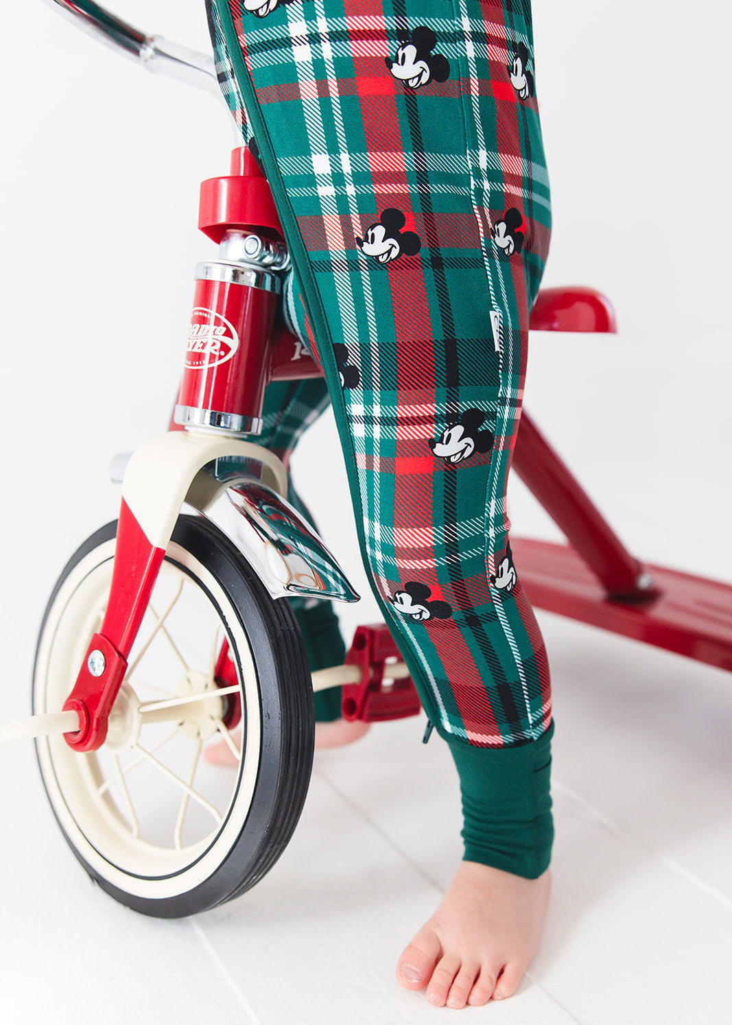 Convertible romper in zippy style with green and red tartan mickey disney print for Christmas family matching pajamas.